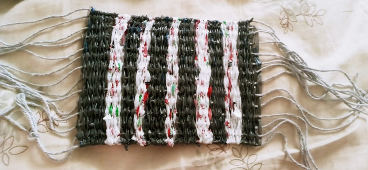 weaving of plastic bags with black and white stripes