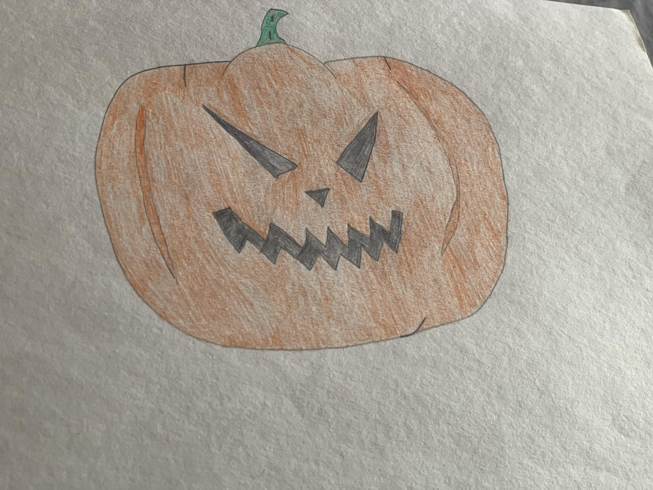 Drawing of a scary carved halloween pumpkin