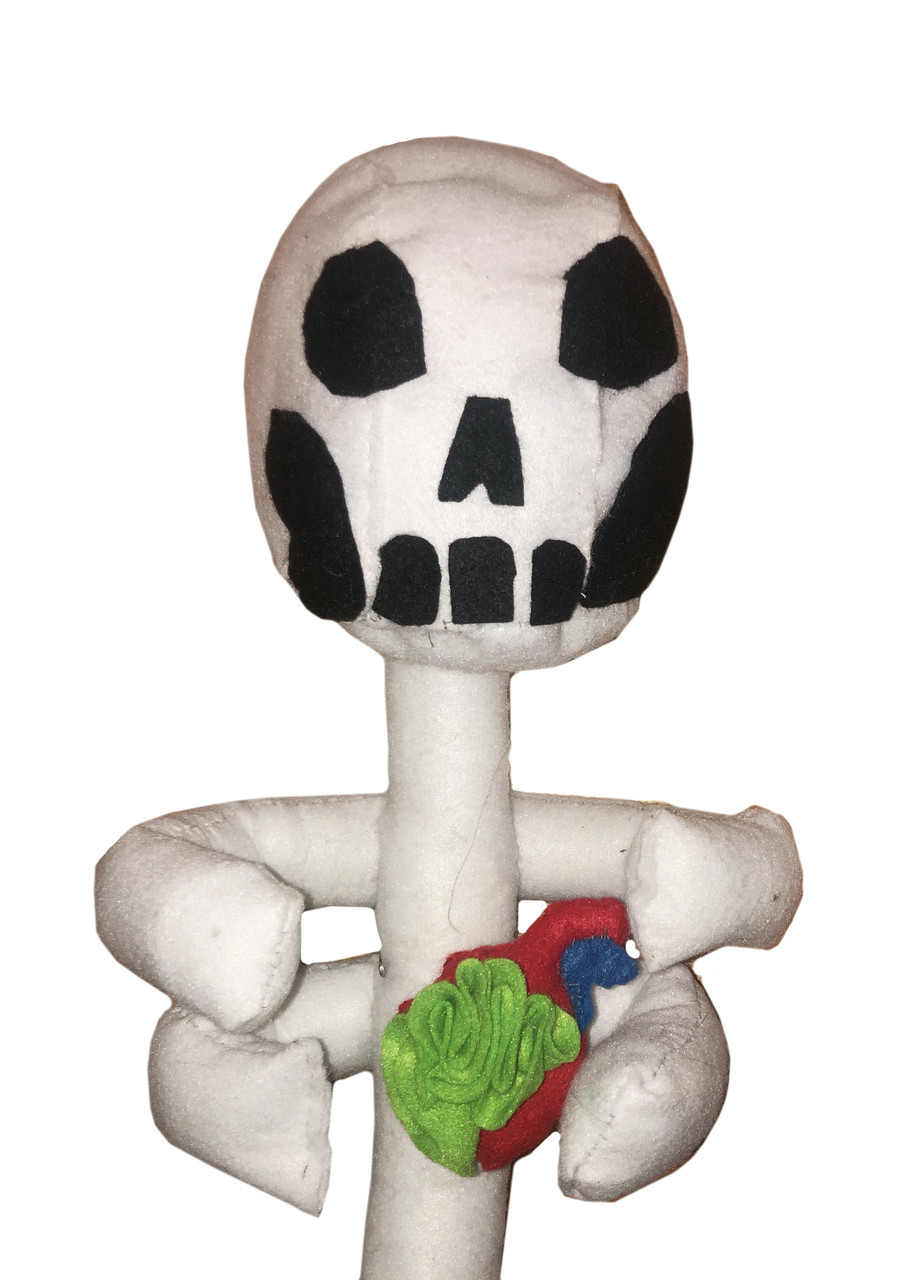 A soft sculpture of a skeleton with a colorful flower