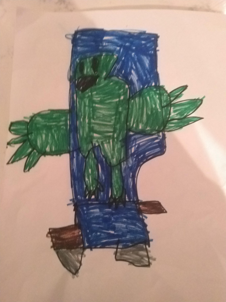 Drawing of a green man with a blue cape