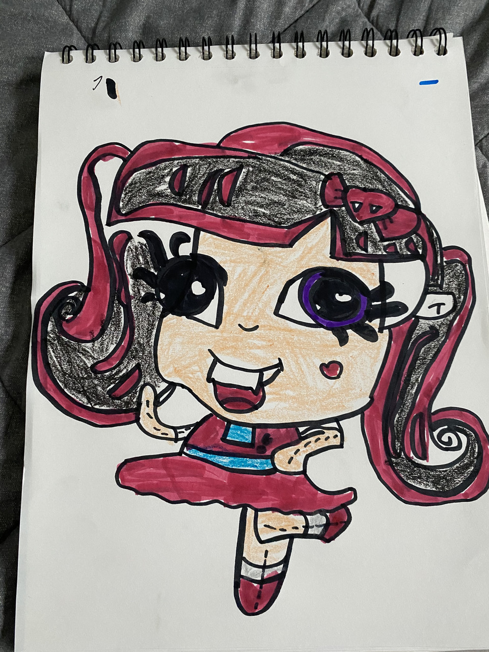 A drawing of a ballerina with a red skirt