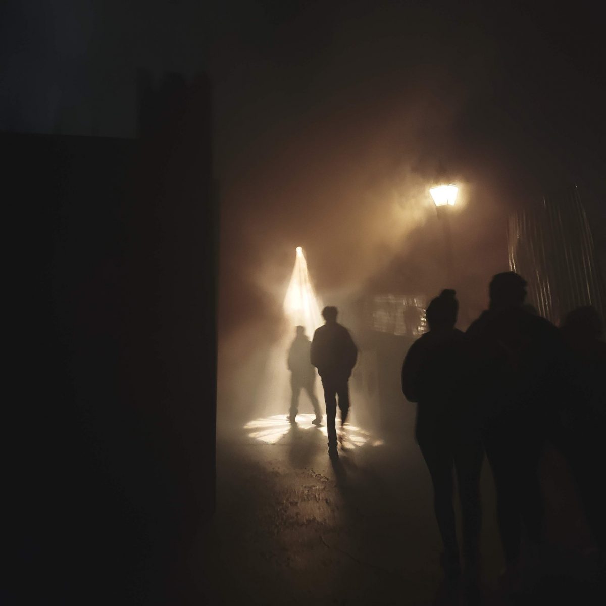Dark photograph of youth at night on the street