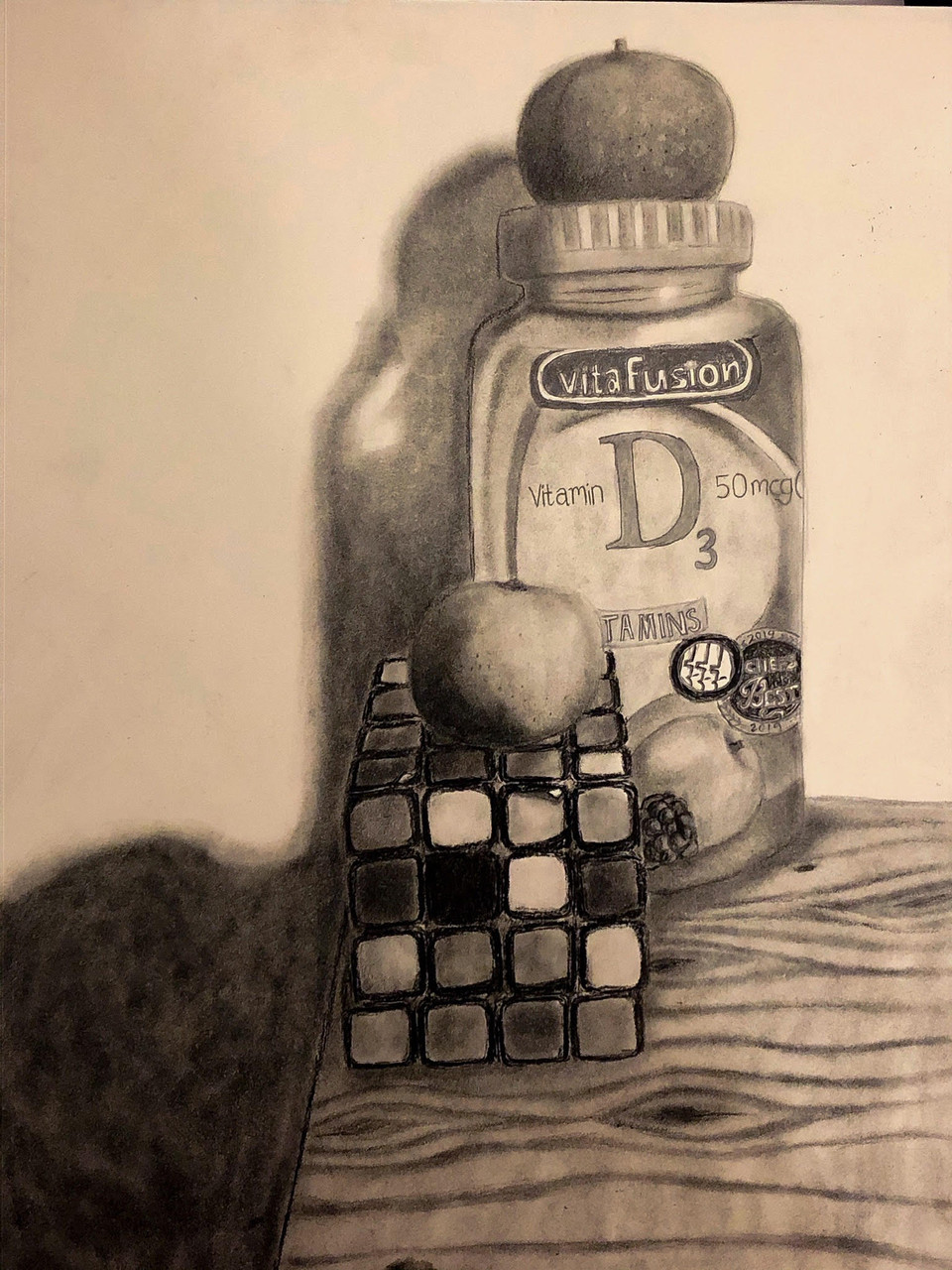 Drawing of a vitamin bottle with a rubik's cube in front