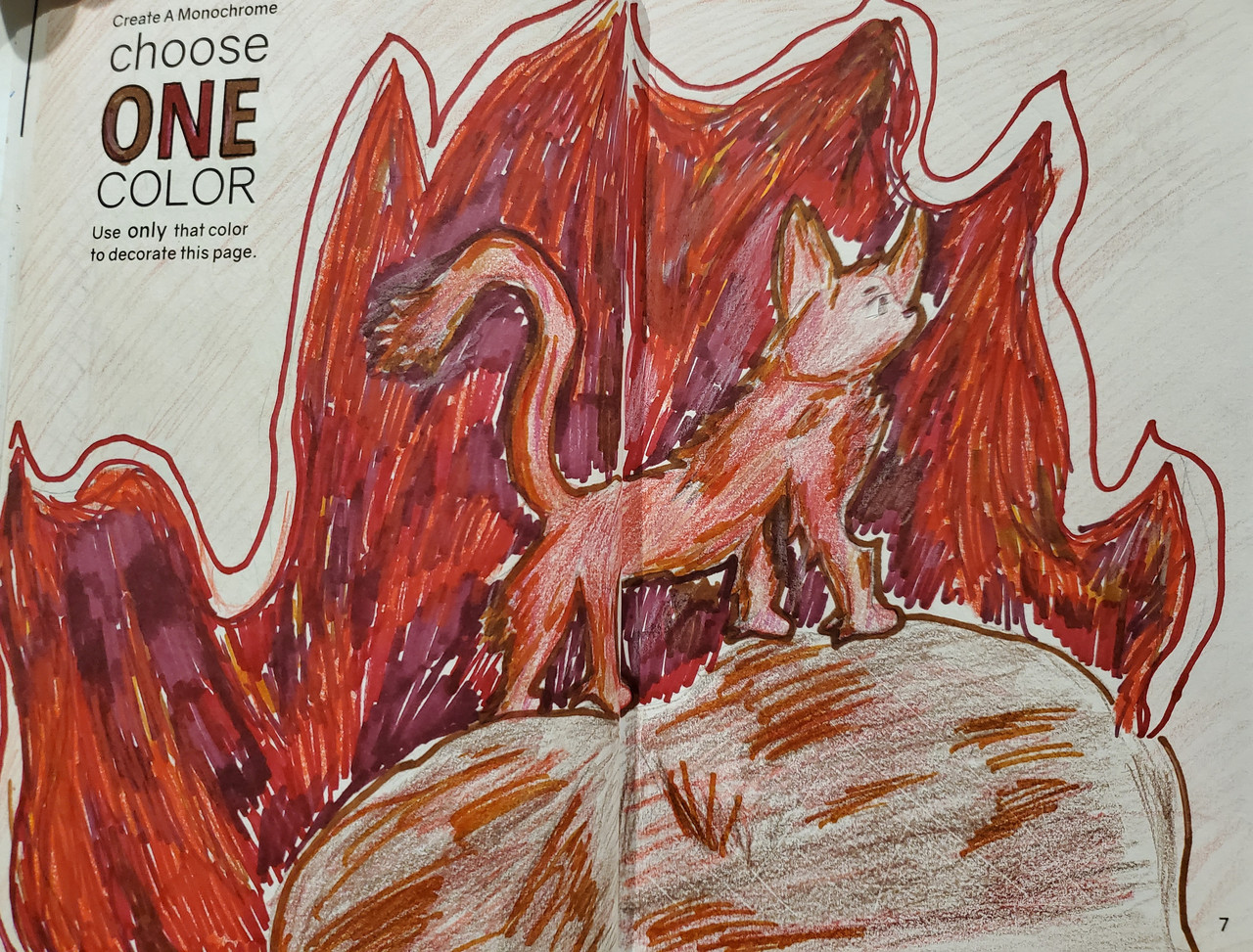 Drawing of a cat in the middle of a bunch of flames.