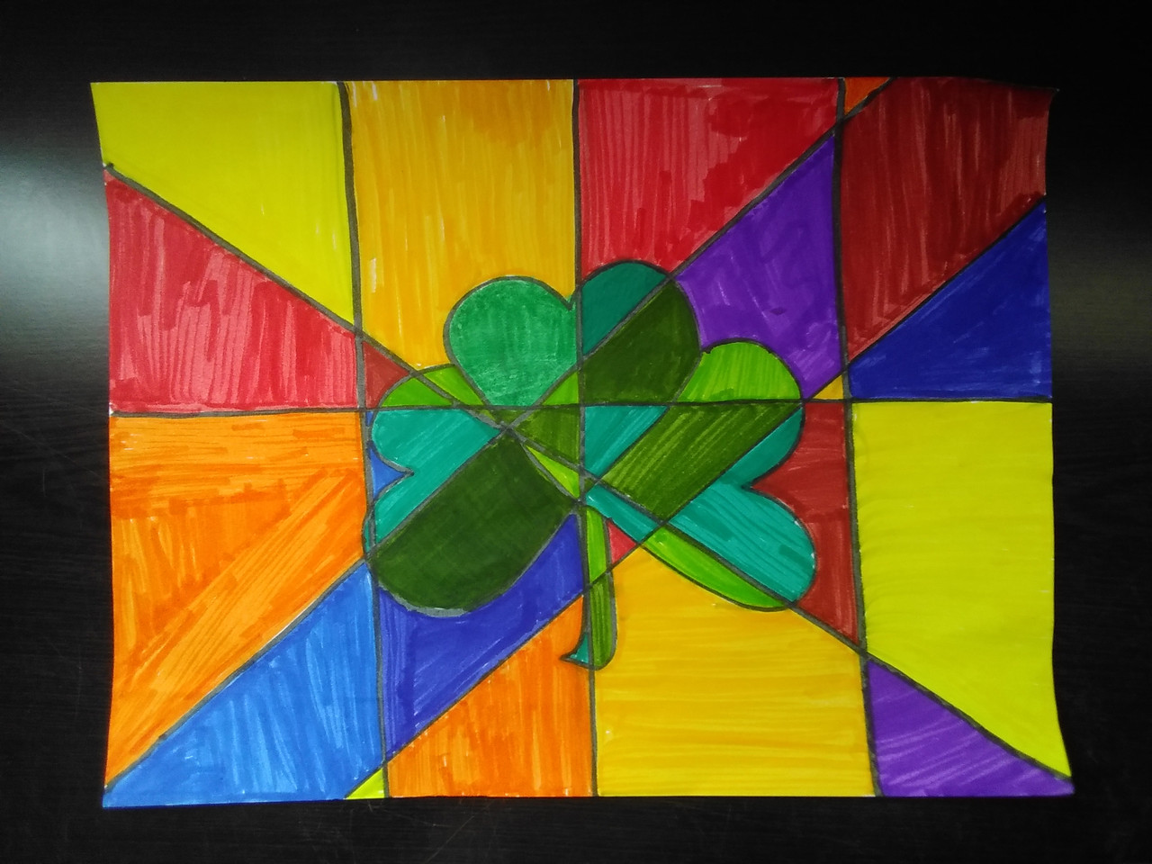 Shamrock drawing with shapes around it