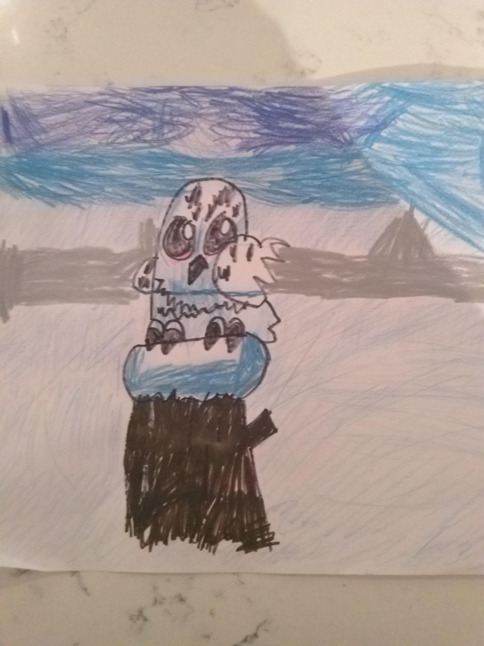 Drawing of an owl on a tree trunk