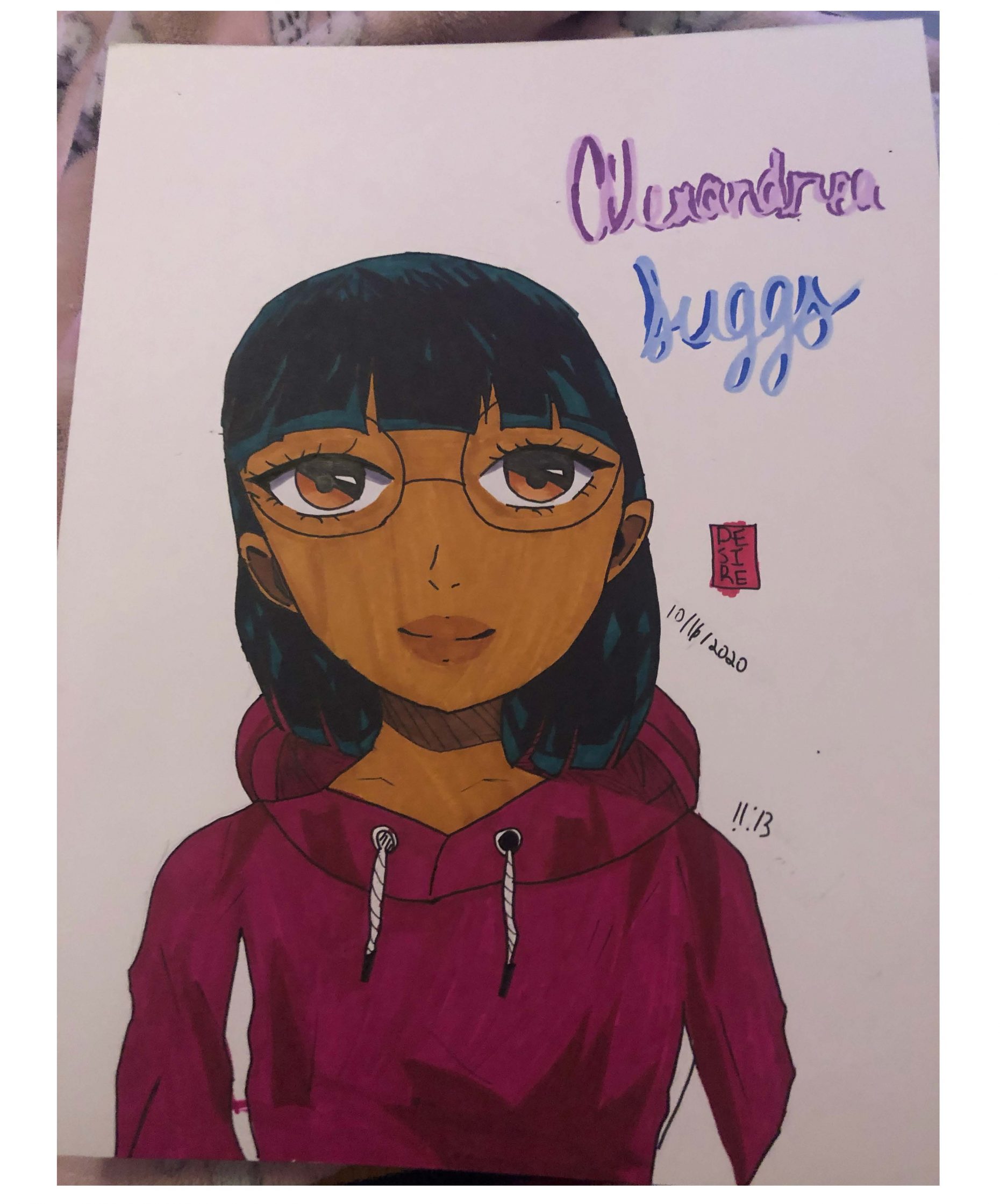 Self portrait of person with dark hair in a purple hoodie