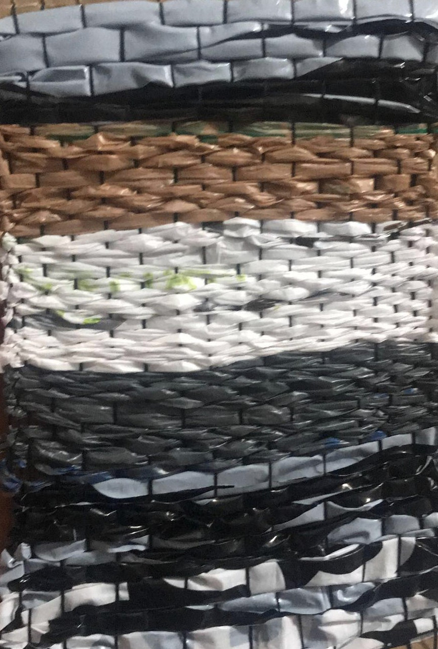 Plastic bag weaving with brown, white, gray, and black