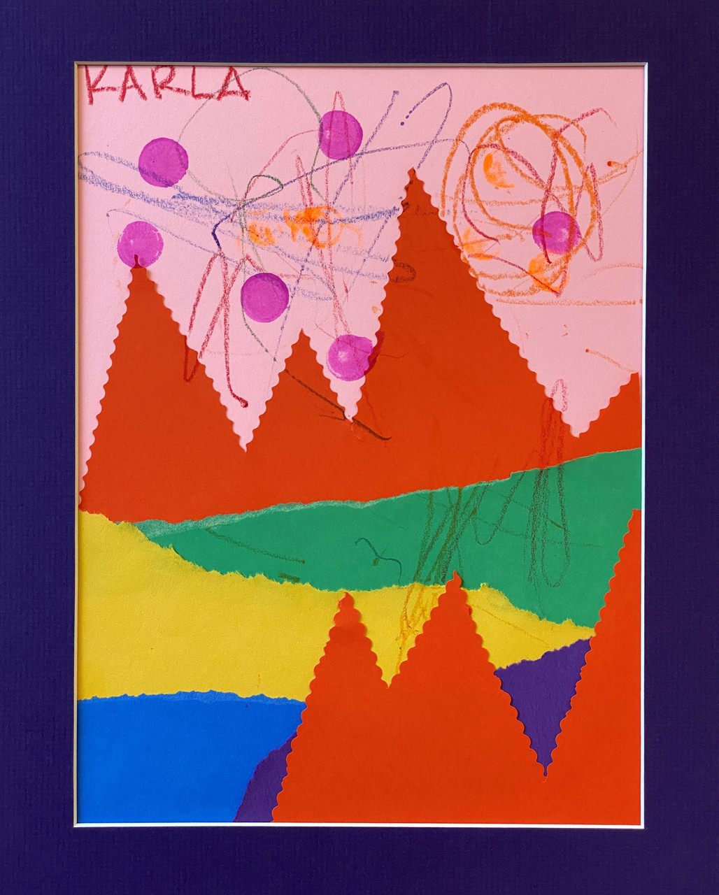 Colorful cut paper mountains with scribbles in the sky