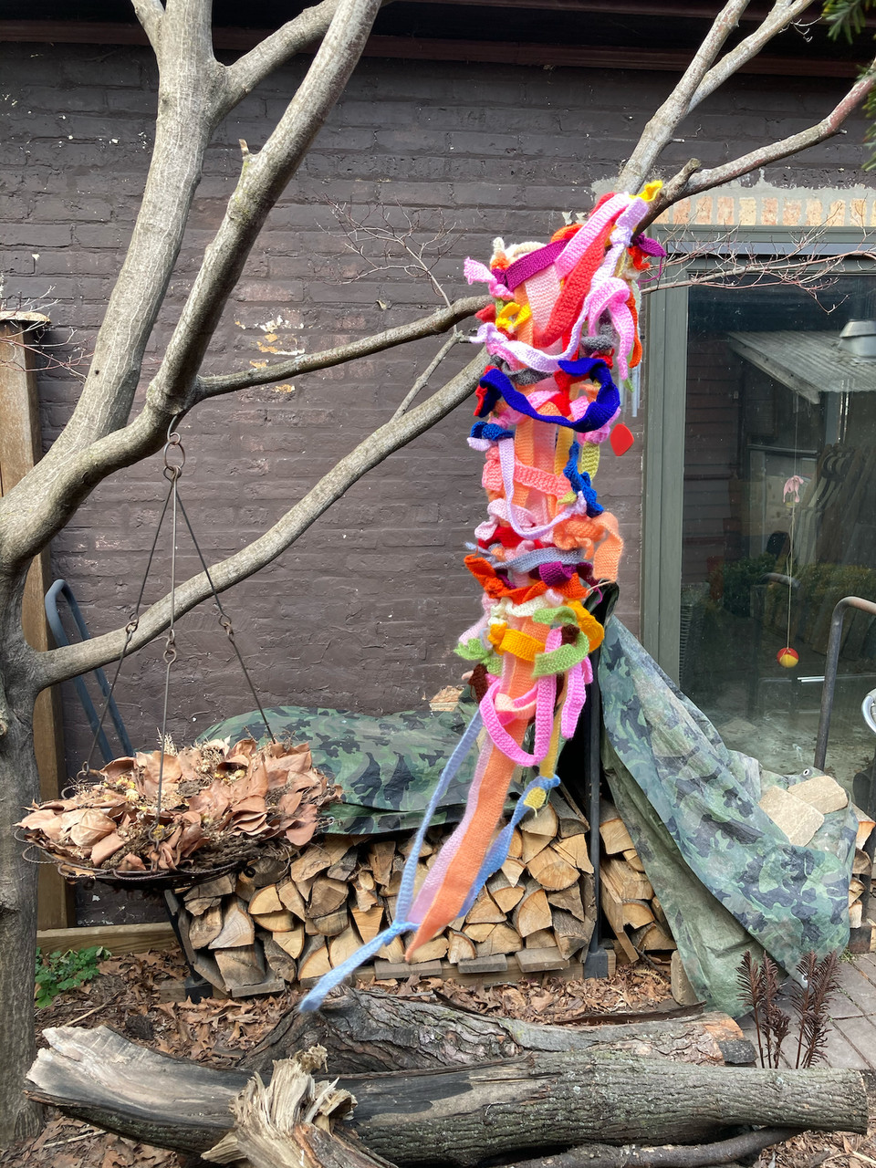 A colorful soft sculpture made of yarn