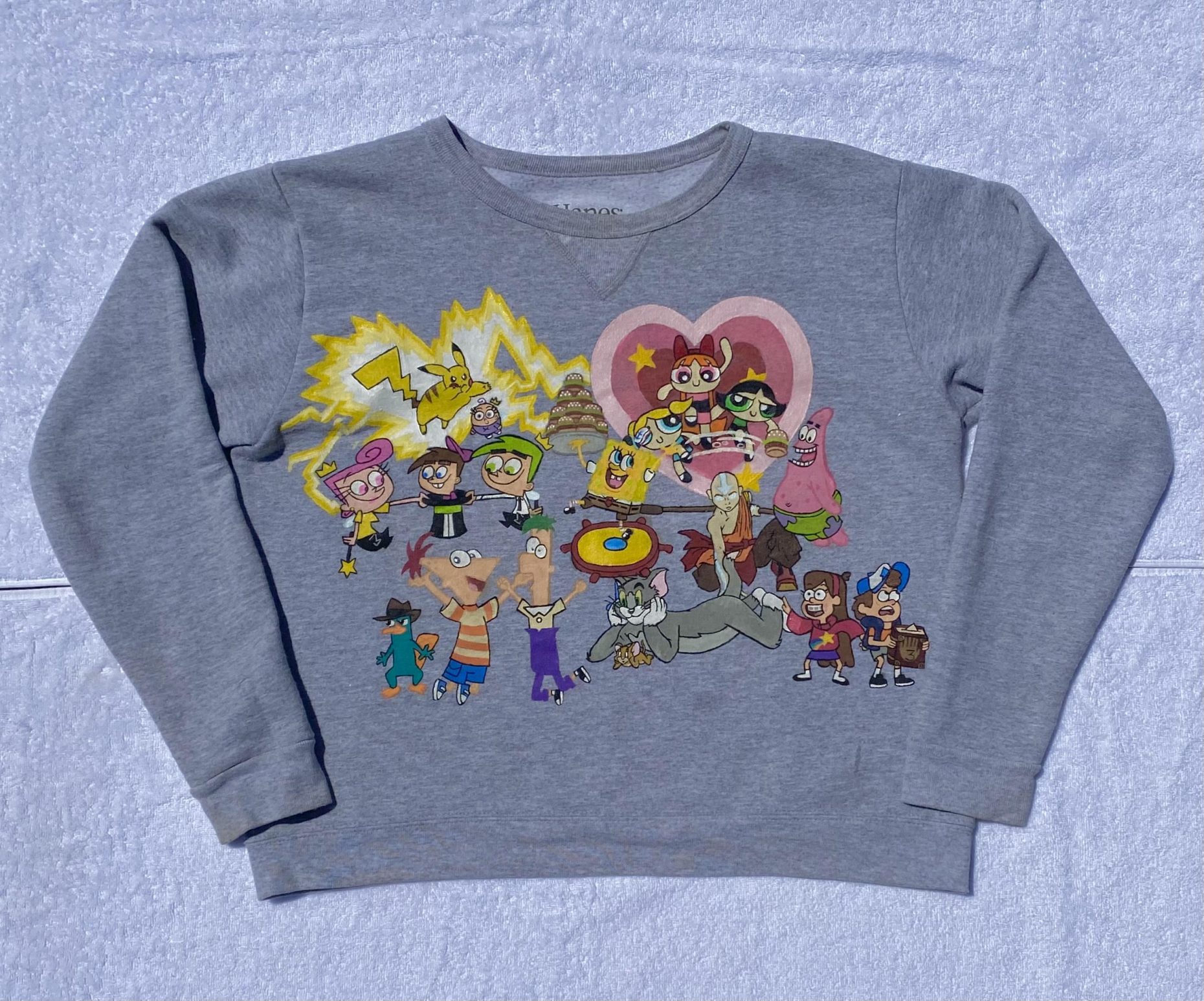 Gray sweatshirt with cartoon characters painted on it. Includes characters from Pokemon, Powerpuff Girls, Phinneus and Ferb, Spongebob, Tom and Jerry, and Gravity Falls among others.