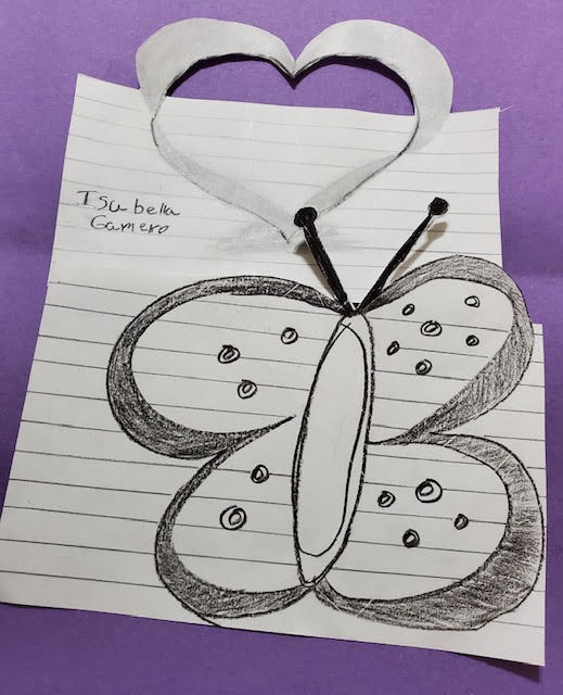 Drawing of a butterfly with a cutout heart above it
