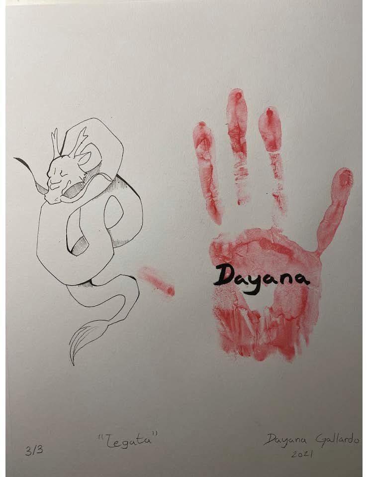 A dragon drawing with a red handprint next to it