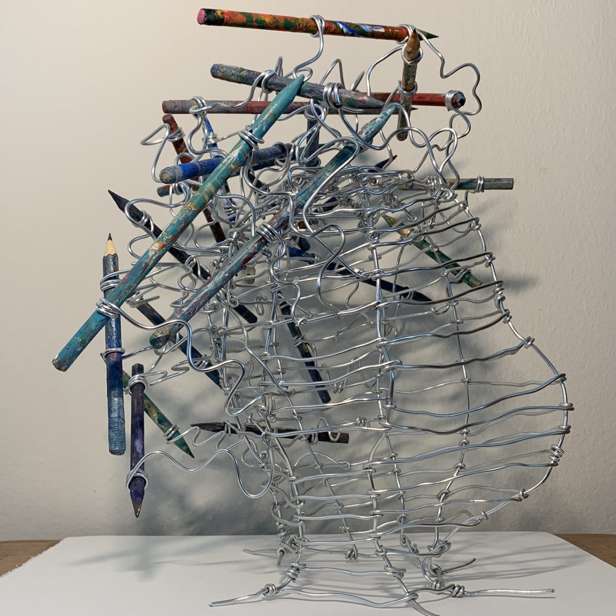 Metal sculpture with pencils