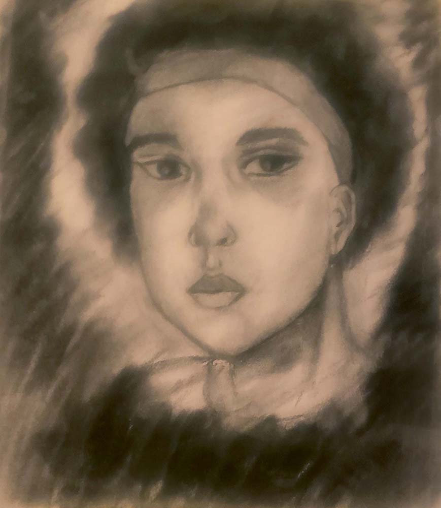Self portrait of person with short hair wearing a headband