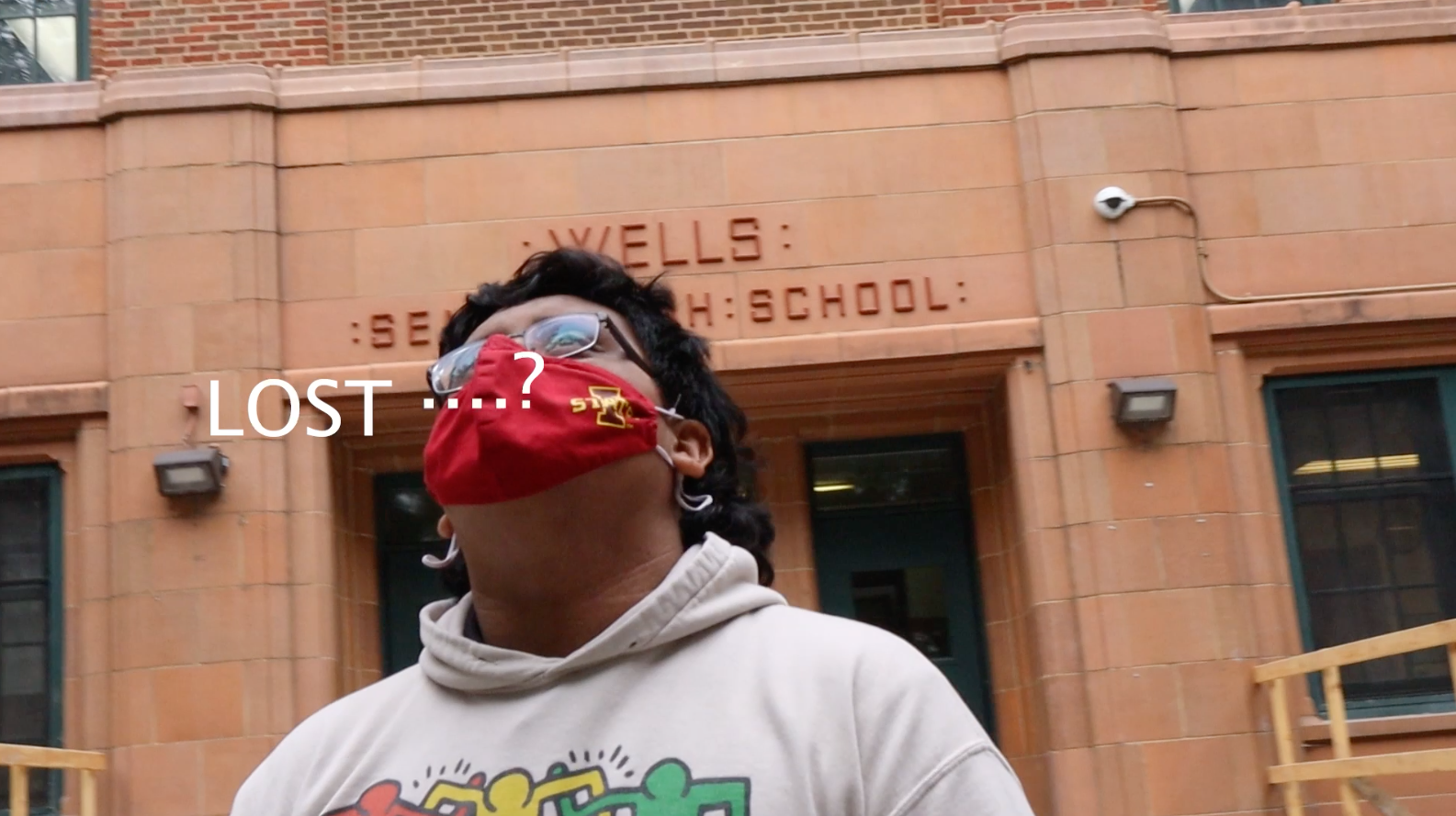 Photo of a person wearing a mask with the phrase "Lost...?" in front of them