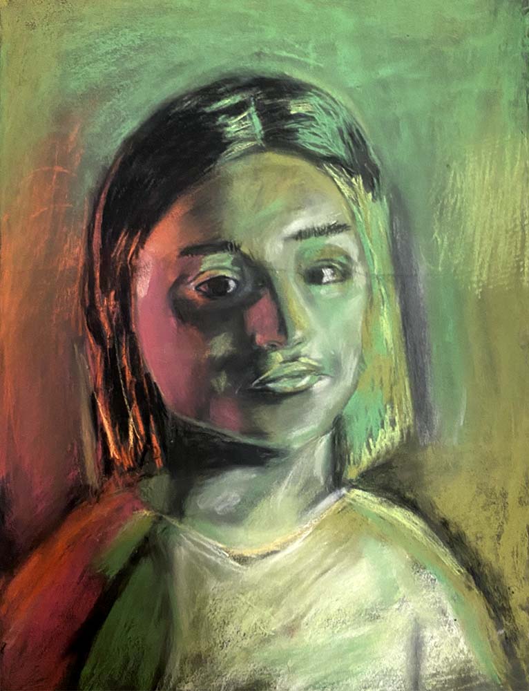 Person with shoulder length hair in yellows and greens.