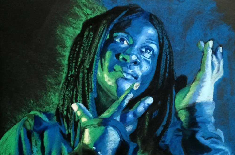 portrait of person in blue and green