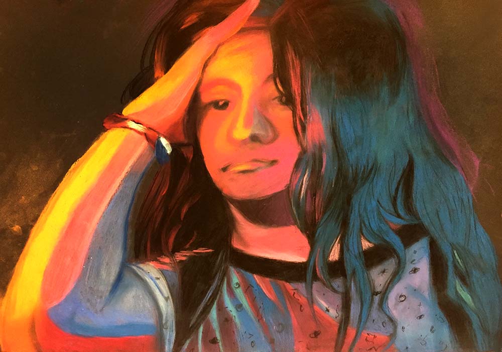portrait of person with long hair wearing bracelet