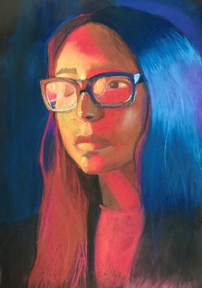 portrait of person wearing glasses looking to the left
