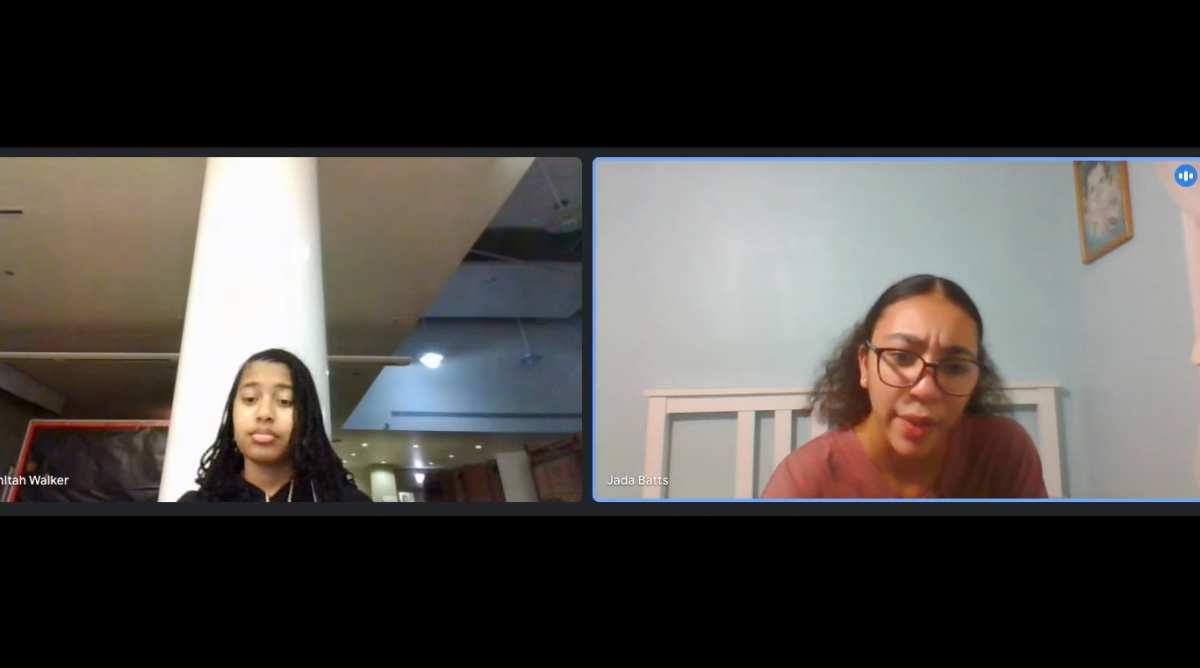 Two people talking to one another side-by-side