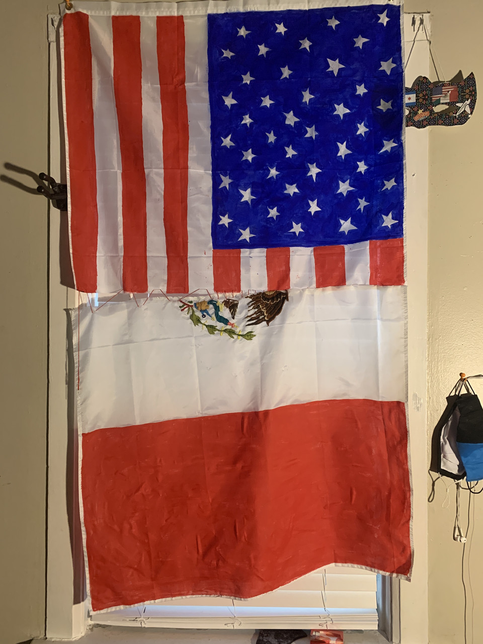 an American flag and a Puerto Rican flag each cut in half and sewn together in the middle