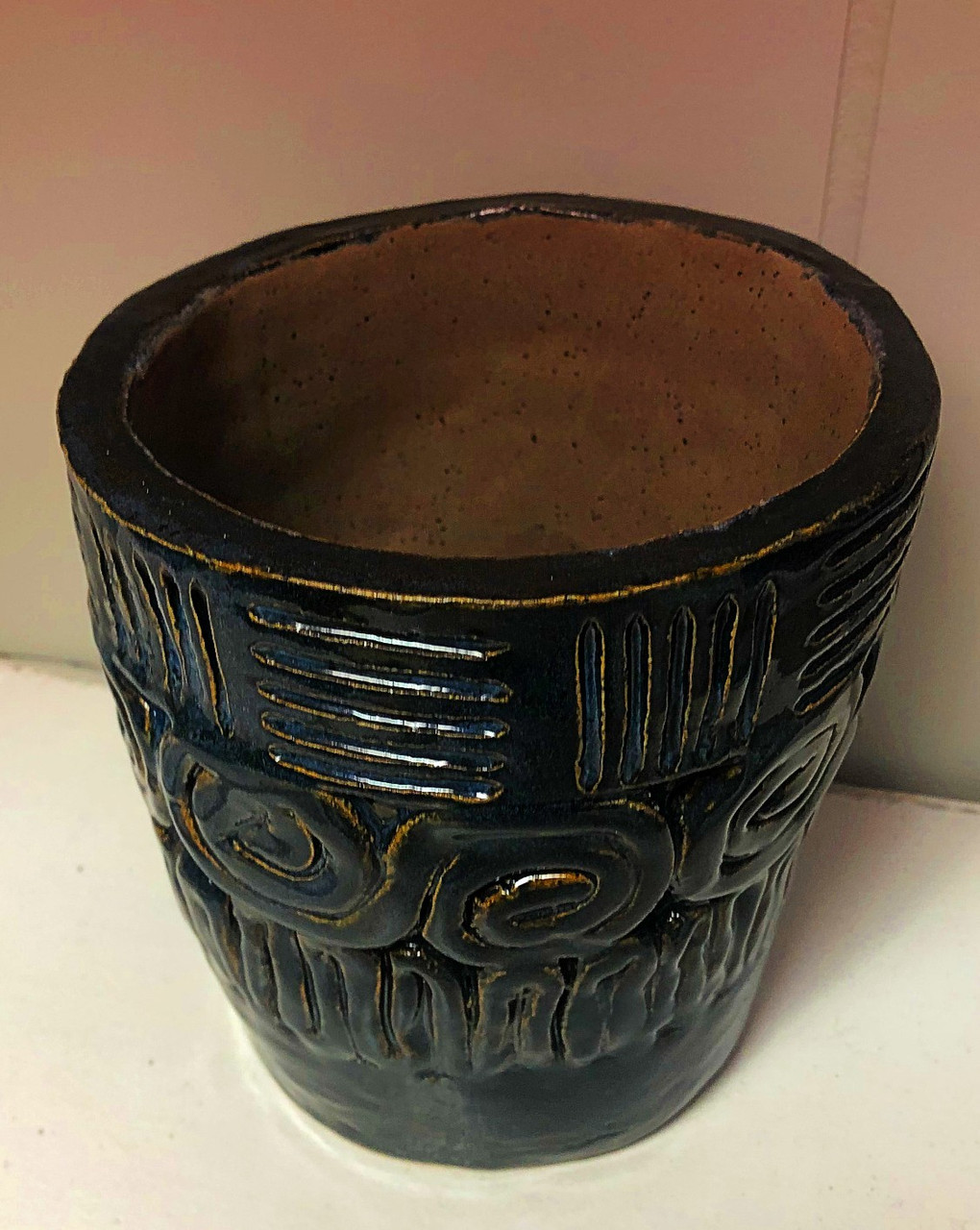 Black ceramic pot with decorations