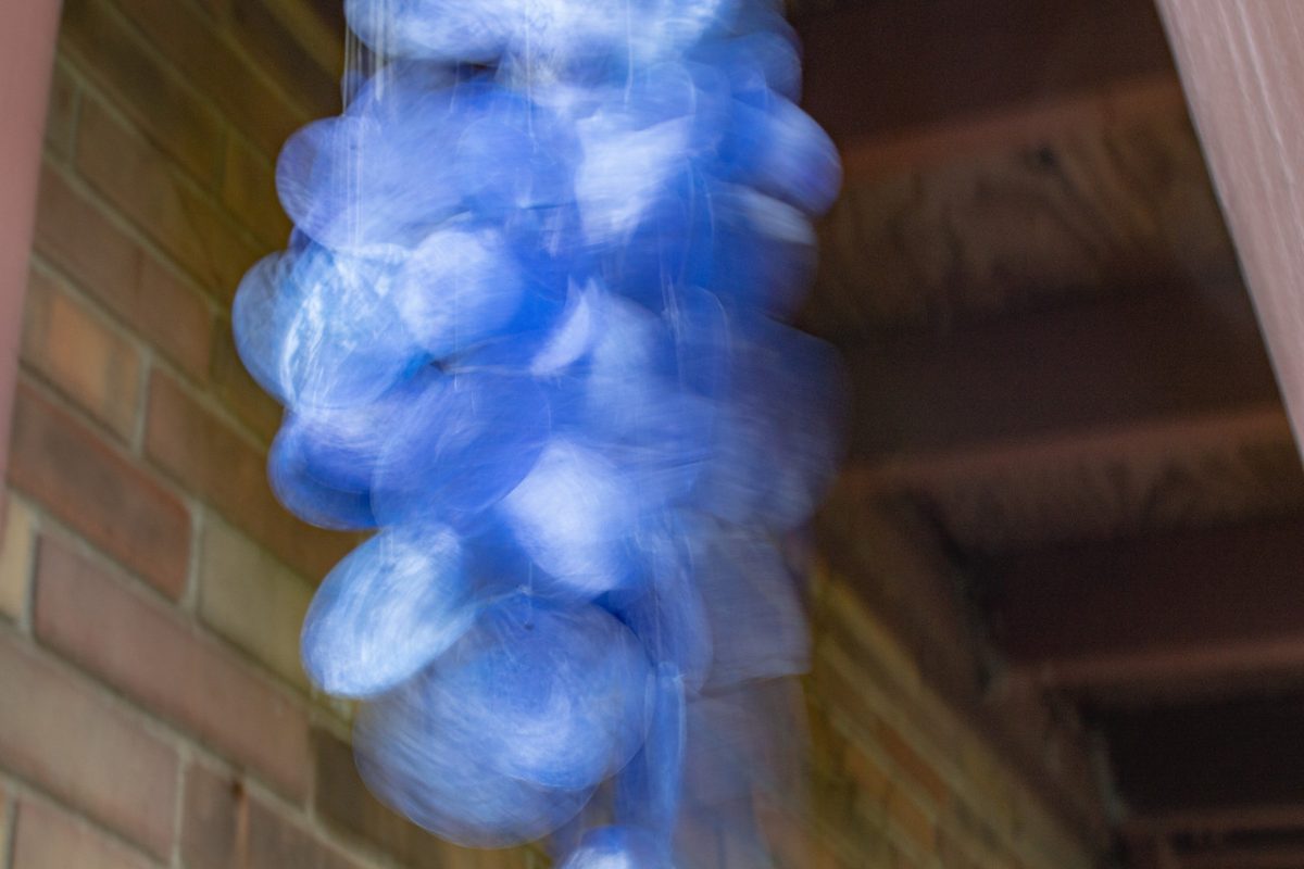 Photograph of seashell wind chimes in motion