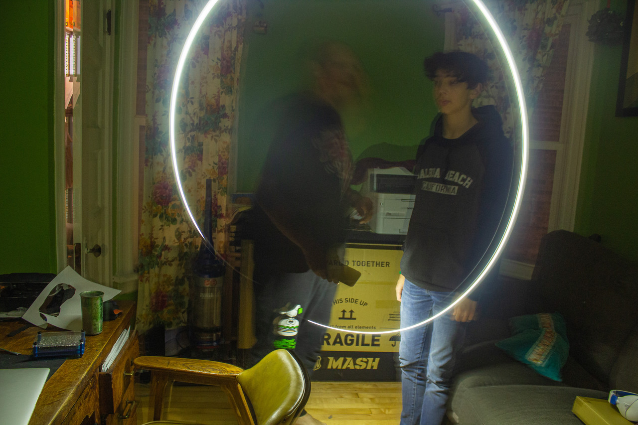 Photograph of a light circle around two people