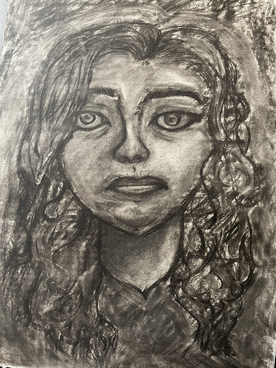 self portrait of a young woman in charcoal