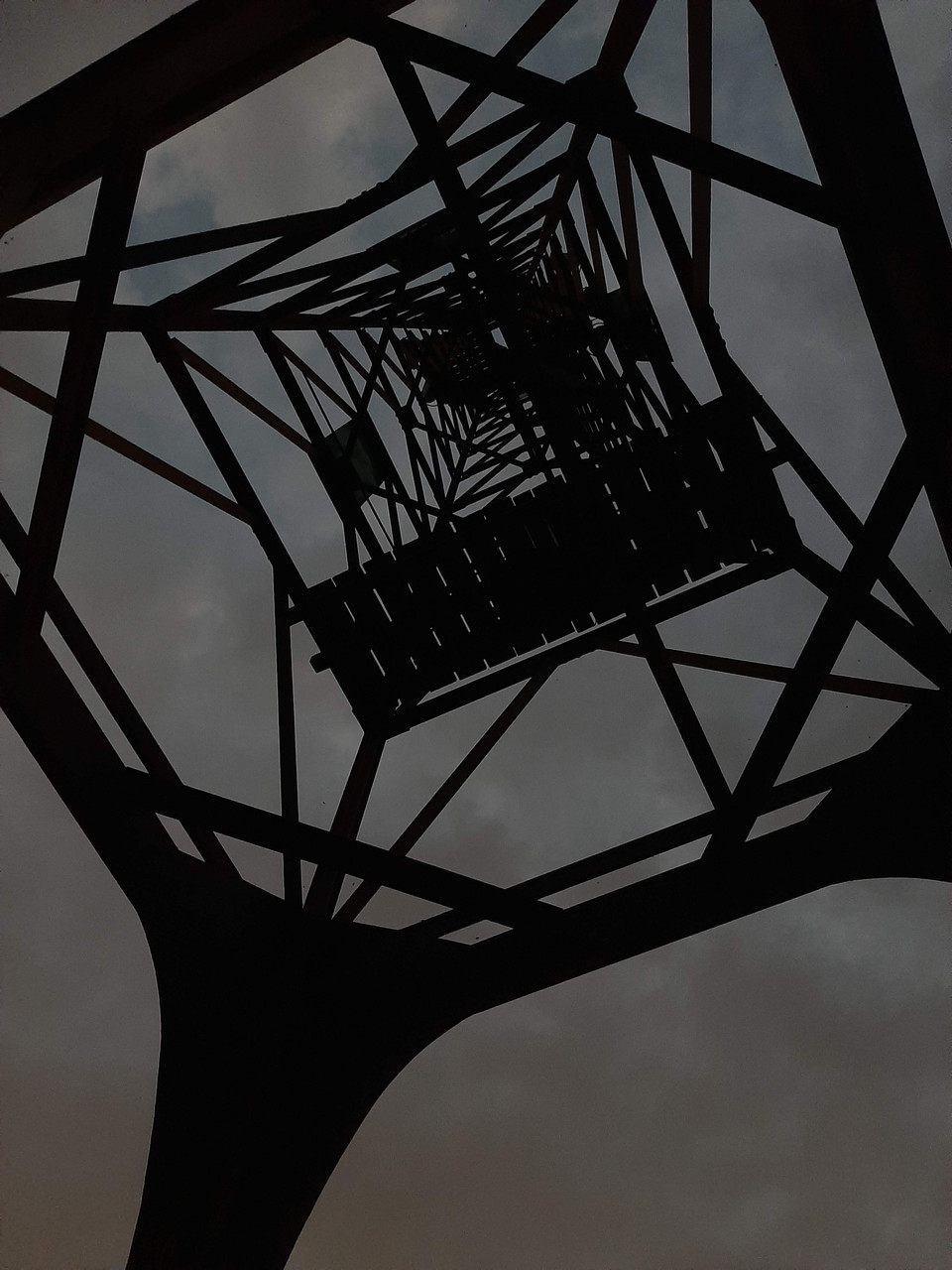 Photograph of a metal structure from below