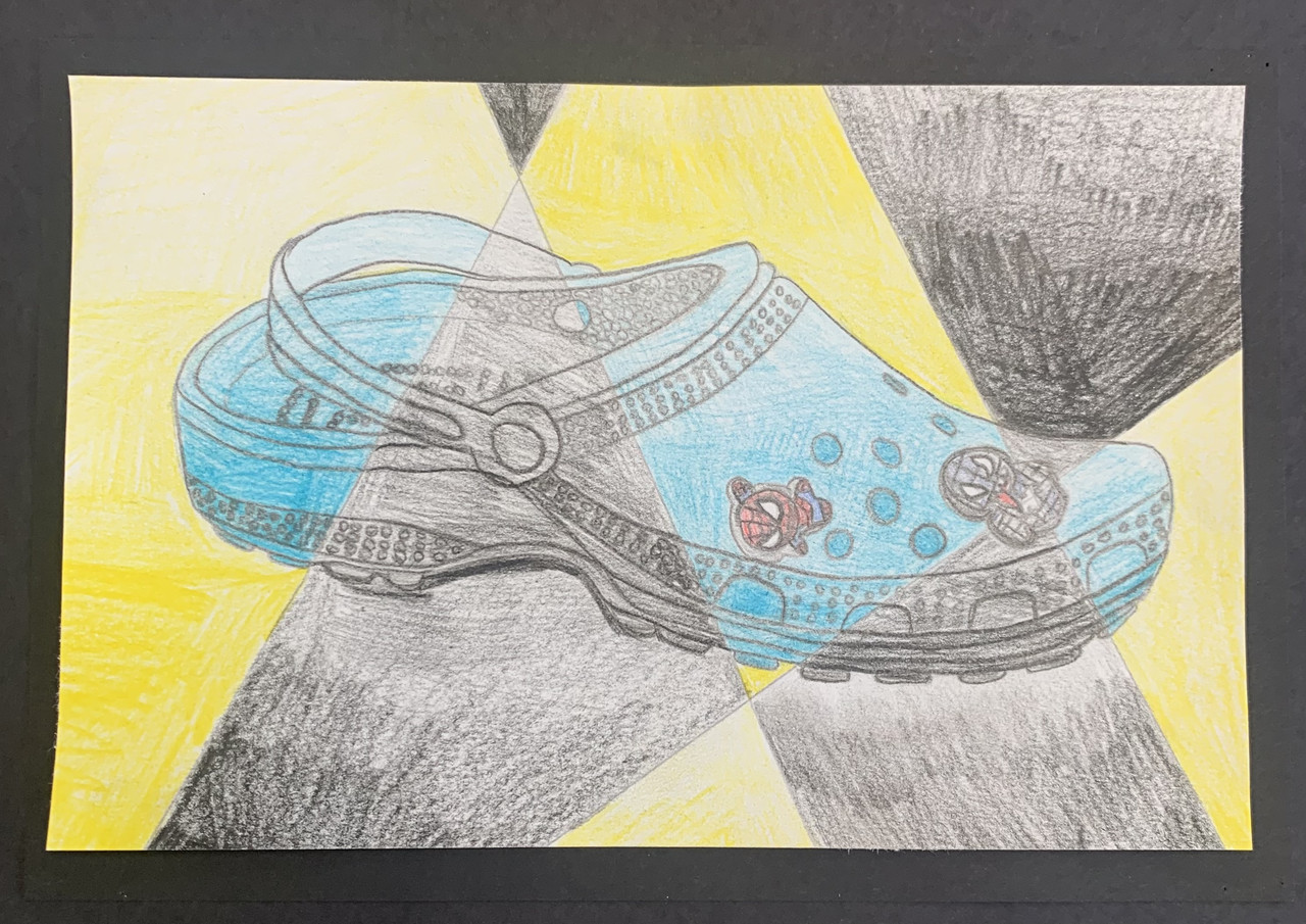 Croc shoe with black and yellow background