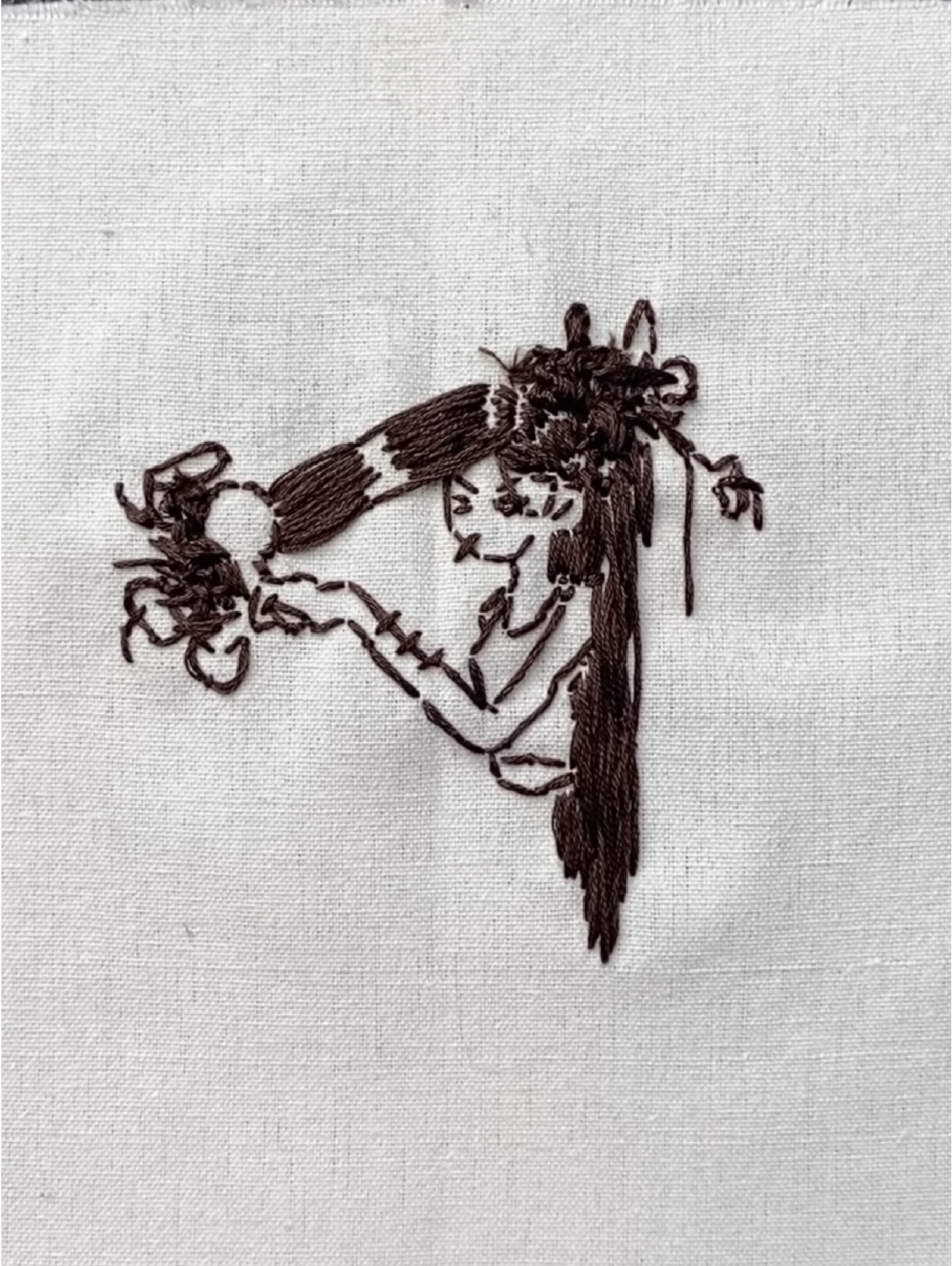 Girl braiding her own hair