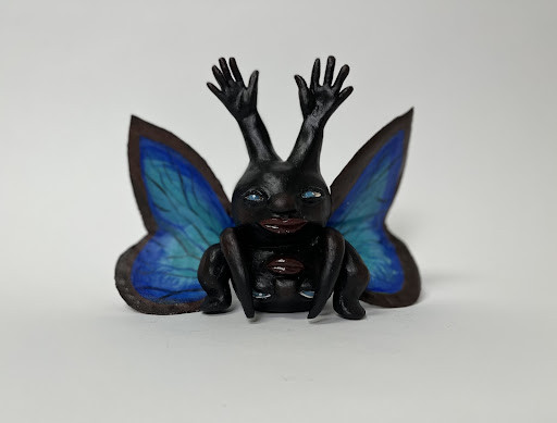 a hybrid butterfly and human creature