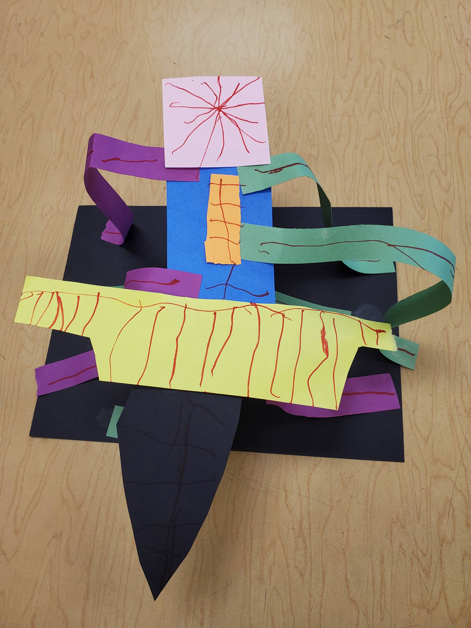 paper sculpture with patterns yellow green blue pink purple