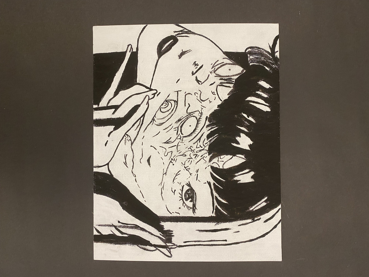 Black and white drawing of a face blending into another face.