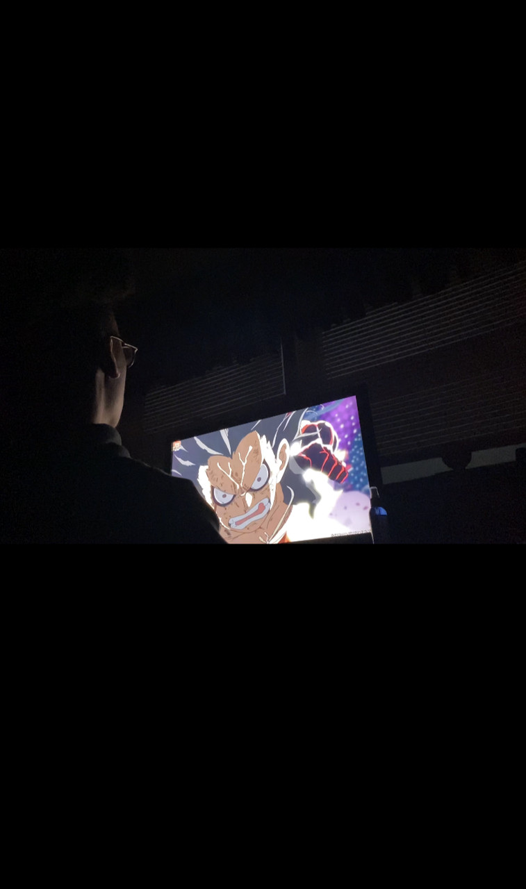 Photo of figure watching a cartoon on tv