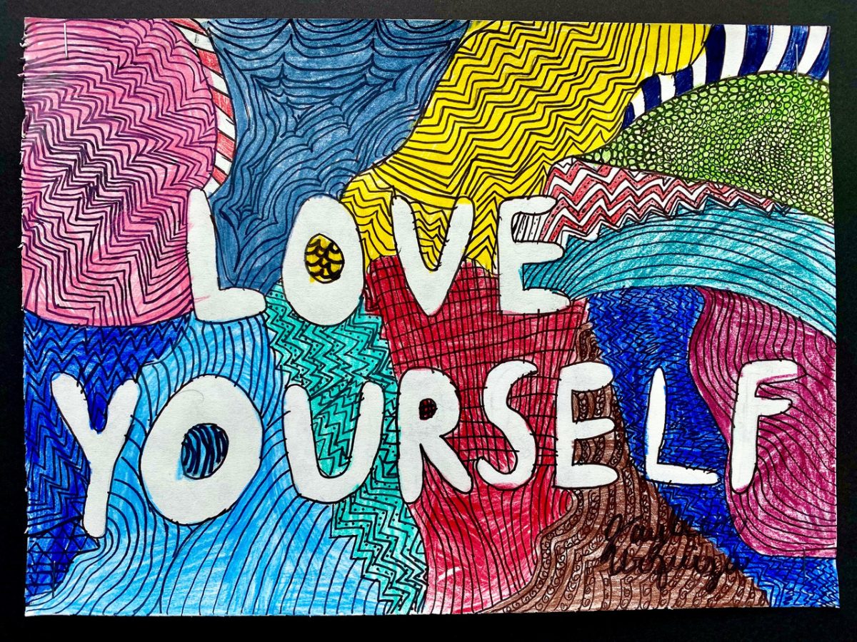 The letters reading "love yourself" in white on a very colorful background