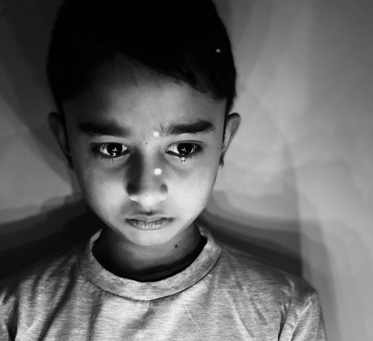 Black and white photo of a small boy