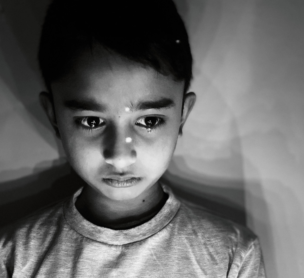 Black and white photo of a small boy