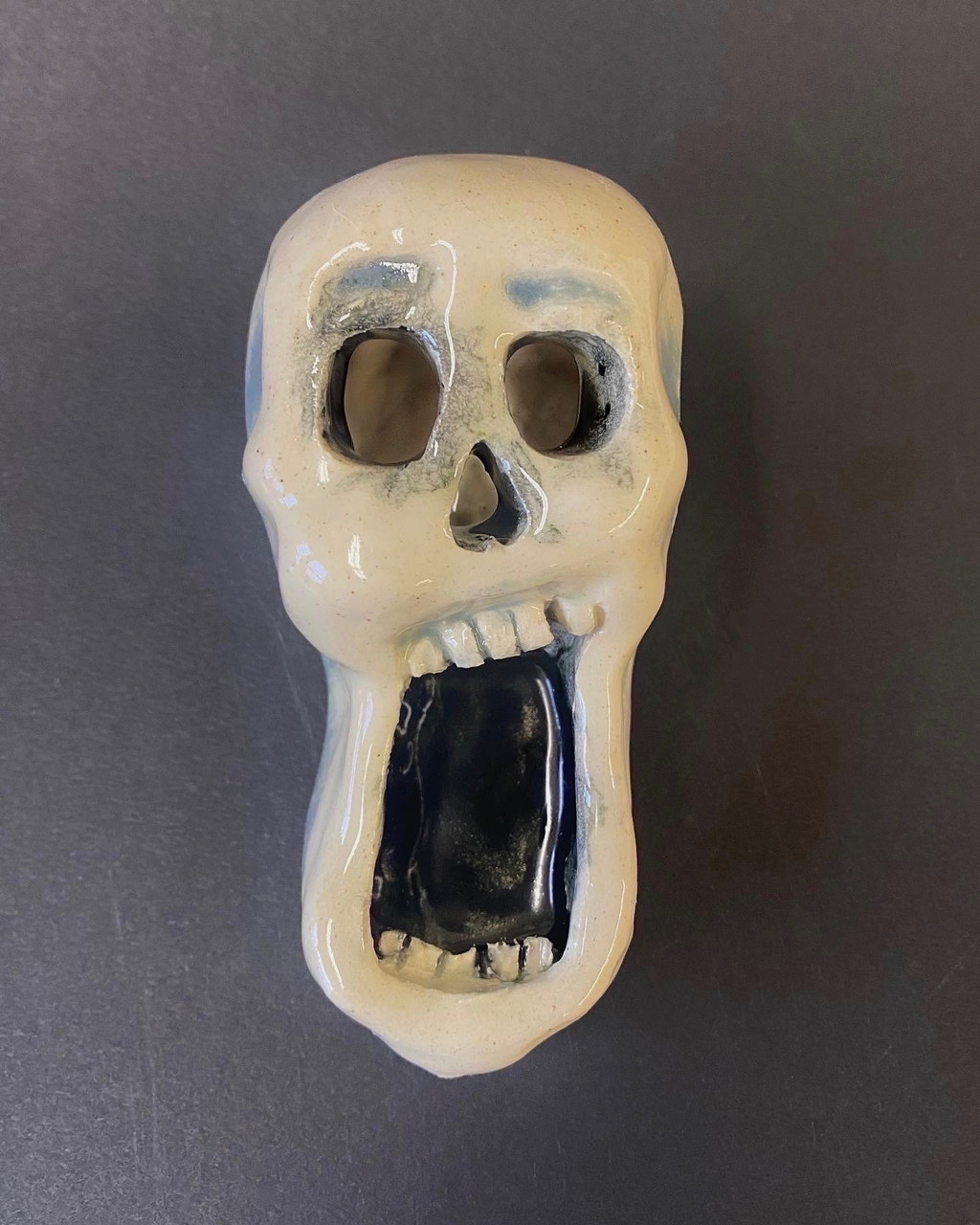 Ceramic skeleton with it's mouth wide open