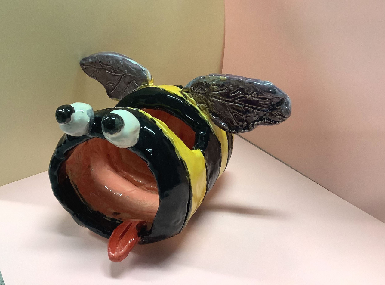 Ceramic bee cell phone holder