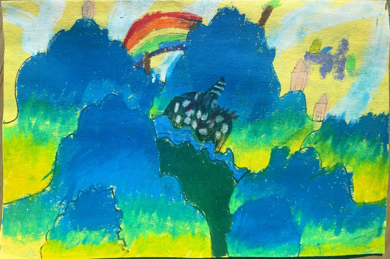 blue and green landscape with a rainbow and castle