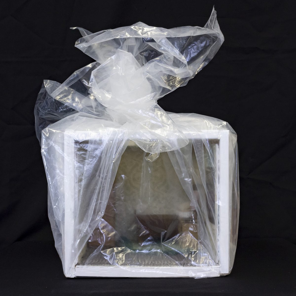 tiny sculpture of a room in a bag