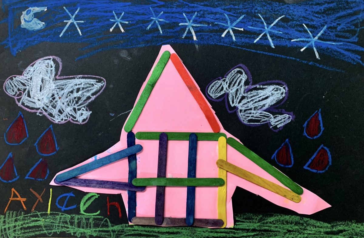 A pink house made of Popsicle sticks