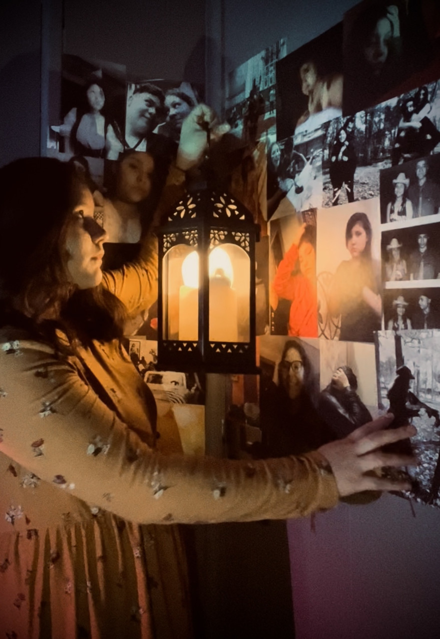 Photo of a girl standing by a lantern