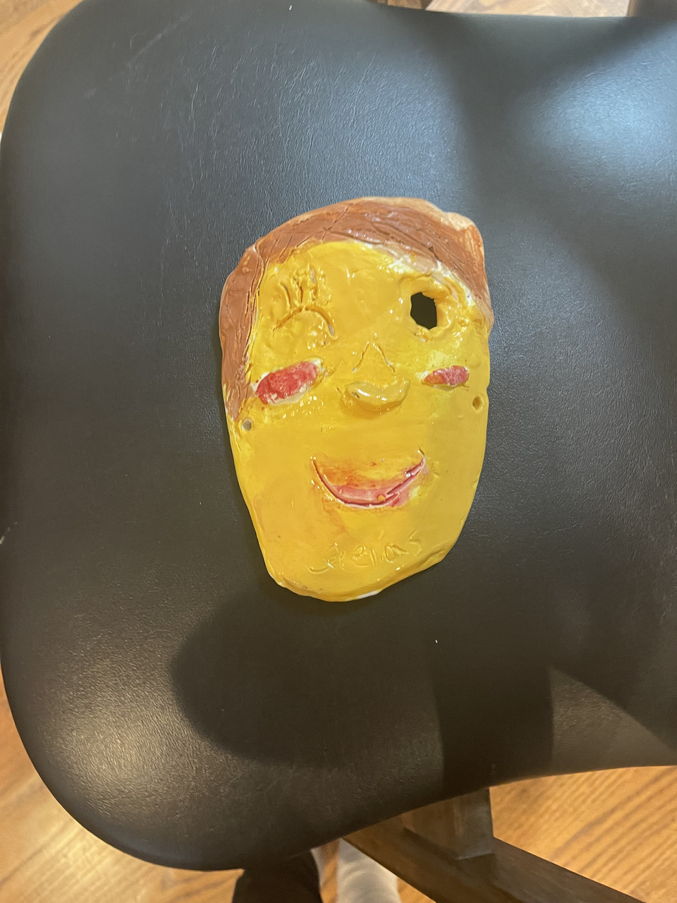 clay yellow face winking