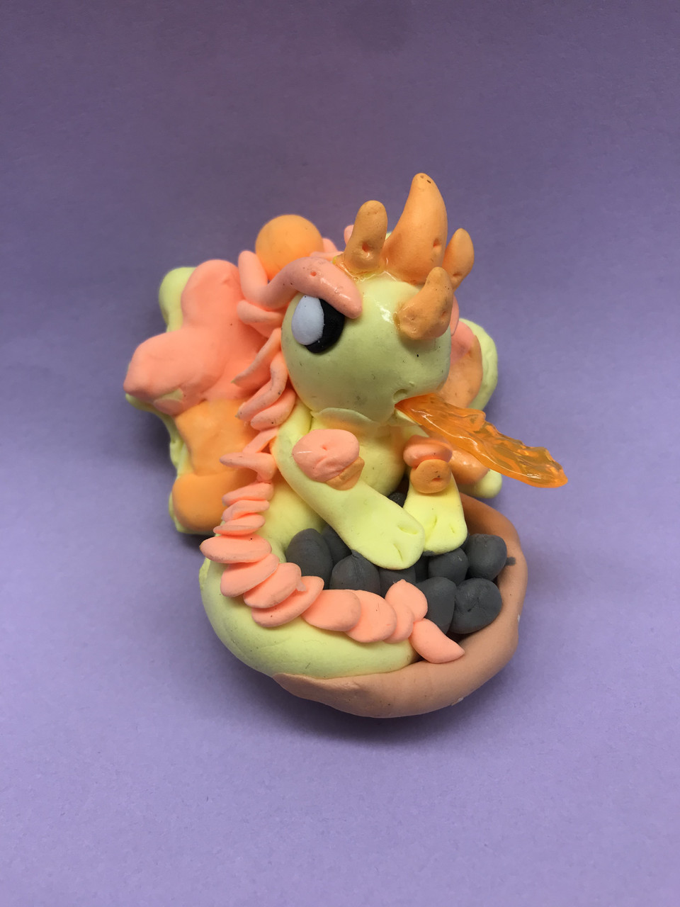 small sculpture of a fiery unicorn