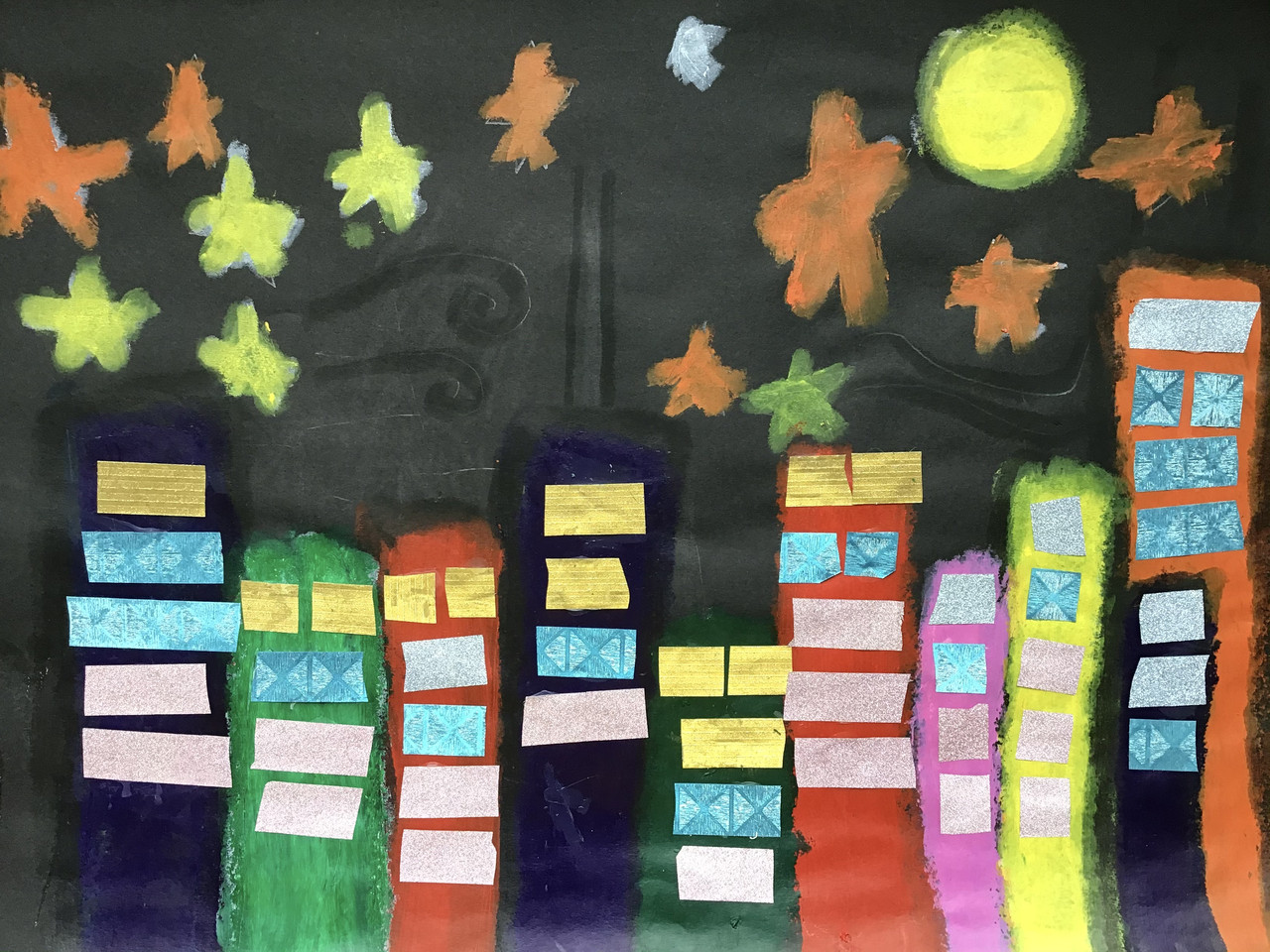 colorful painting of buildings with stars and a moon