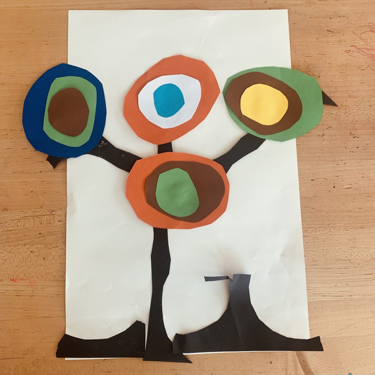 paper cutout recreation of a kandinsky design of flowers